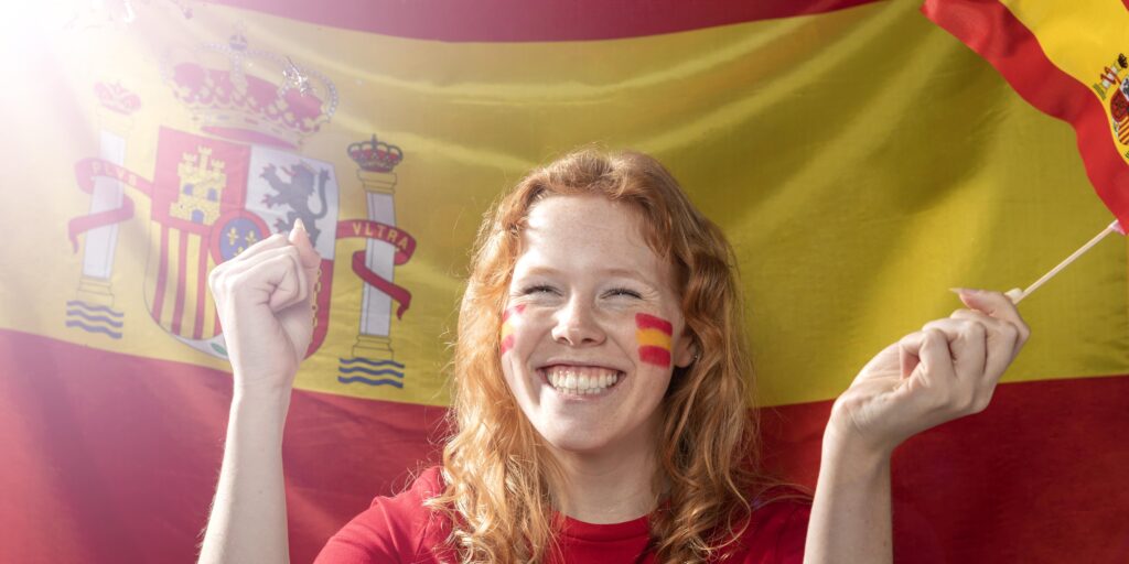smiley woman holding spanish flag Tu Apostilla is your top choice to apostille US documents in Spain. Order today!